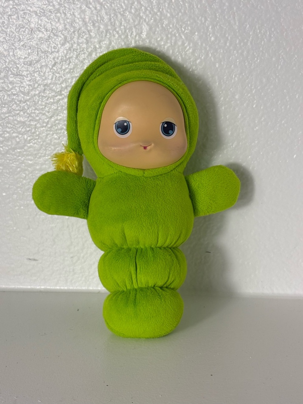 Cute 2009 Playskool / Hasbro Gloworm plush doll in bright green.